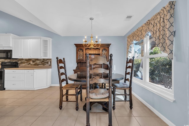 308 Dendy Ct, Myrtle Beach, SC 29579 - dining space with a chandelier, light tile patterned floors, vaulted ceiling, and baseboards