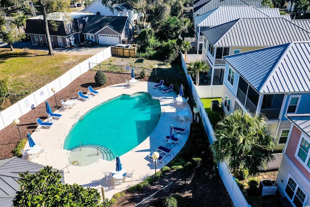 408 7th Ave S, North Myrtle Beach, SC 29582 - community pool with a fenced backyard and a patio