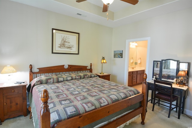 408 7th Ave S, North Myrtle Beach, SC 29582 - bedroom featuring light carpet, connected bathroom, and ceiling fan