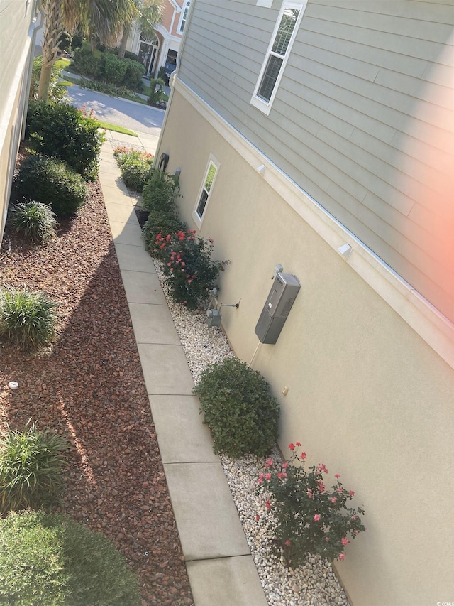 408 7th Ave S, North Myrtle Beach, SC 29582 - view of side of property featuring stucco siding