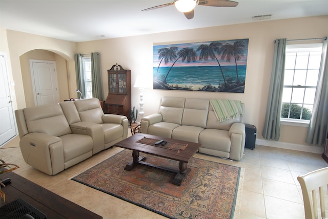 408 7th Ave S, North Myrtle Beach, SC 29582 - living area with arched walkways, a ceiling fan, and light tile patterned floors