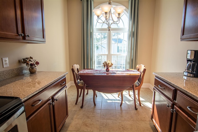 408 7th Ave S, North Myrtle Beach, SC 29582 - dining room with a chandelier and light tile patterned floors
