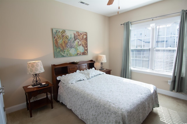 408 7th Ave S, North Myrtle Beach, SC 29582 - bedroom with light carpet, multiple windows, and ceiling fan