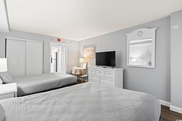 6804 Ocean Blvd N Unit 1529, Myrtle Beach, SC 29572 - bedroom featuring a closet, baseboards, and dark wood-style floors