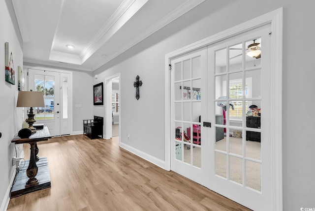 529 Oak Lawn Rd, Georgetown, SC 29440 - interior space with baseboards, light wood-style floors, a tray ceiling, and crown molding