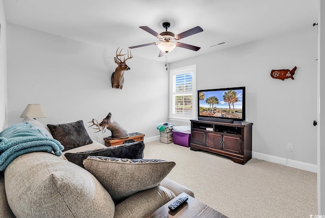 529 Oak Lawn Rd, Georgetown, SC 29440 - carpeted living area with visible vents, baseboards, and a ceiling fan
