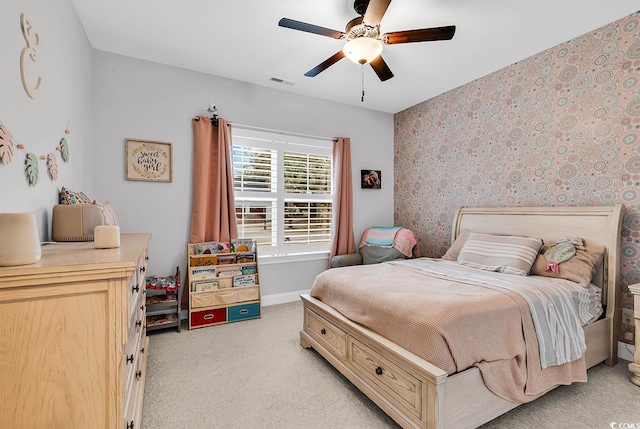 529 Oak Lawn Rd, Georgetown, SC 29440 - bedroom featuring ceiling fan, visible vents, light carpet, wallpapered walls, and baseboards