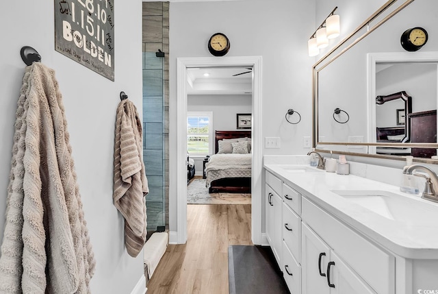 529 Oak Lawn Rd, Georgetown, SC 29440 - full bath with double vanity, a sink, connected bathroom, and wood finished floors