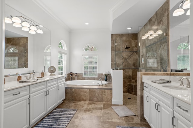 7268 Seville Dr, Myrtle Beach, SC 29572 - full bathroom featuring tiled shower, ornamental molding, a bath, and two vanities