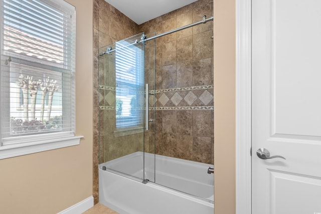 7268 Seville Dr, Myrtle Beach, SC 29572 - bathroom with combined bath / shower with glass door and baseboards