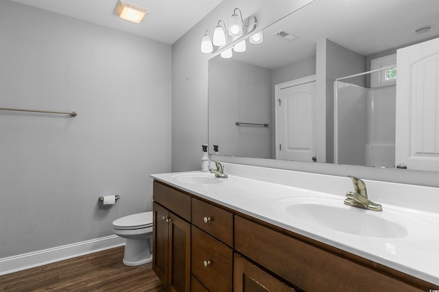 1524 Stilley Cir, Conway, SC 29526 - full bathroom featuring baseboards, wood finished floors, toilet, a shower, and double vanity