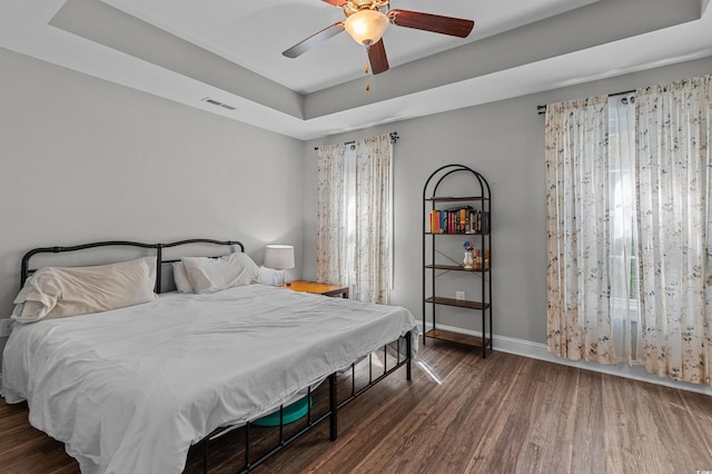 1524 Stilley Cir, Conway, SC 29526 - bedroom featuring a raised ceiling, wood finished floors, baseboards, and a ceiling fan