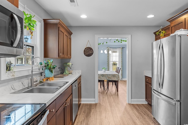 1524 Stilley Cir, Conway, SC 29526 - kitchen featuring stainless steel appliances, light wood-style flooring, baseboards, a sink, and recessed lighting