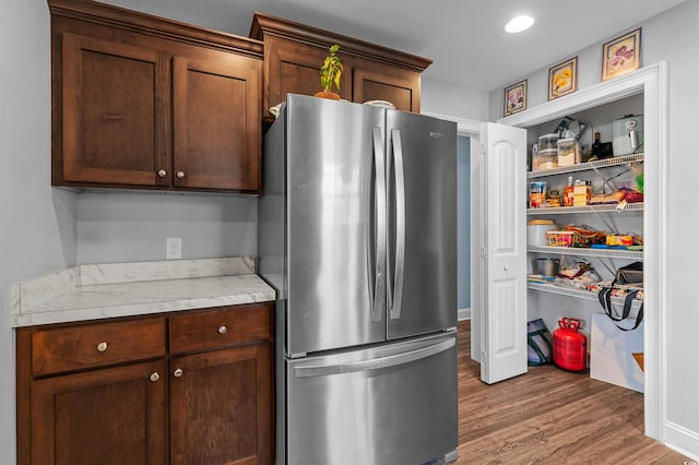 1524 Stilley Cir, Conway, SC 29526 - kitchen with freestanding refrigerator, wood finished floors, light countertops, and dark brown cabinets