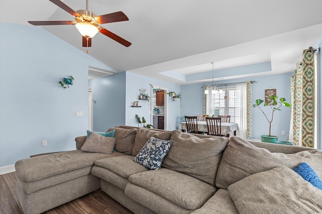 1524 Stilley Cir, Conway, SC 29526 - living area featuring dark wood finished floors, a ceiling fan, a chandelier, a tray ceiling, and lofted ceiling
