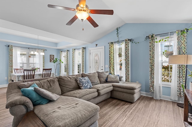 1524 Stilley Cir, Conway, SC 29526 - living area with a chandelier, light wood-type flooring, baseboards, vaulted ceiling, and ceiling fan