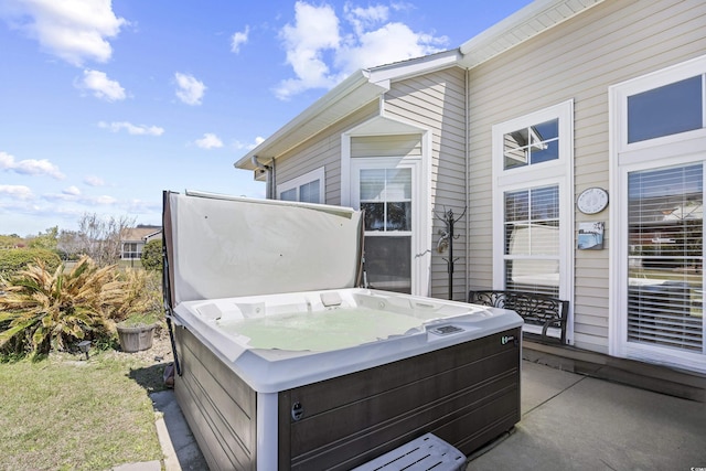 deck featuring a hot tub