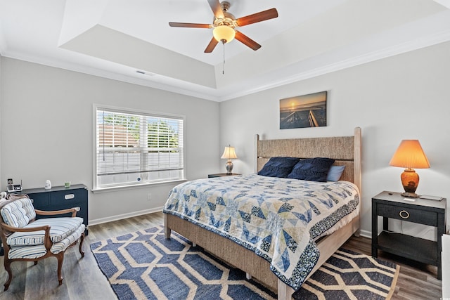 361 Rycola Cir, Myrtle Beach, SC 29575 - bedroom featuring a tray ceiling, wood finished floors, baseboards, crown molding, and ceiling fan