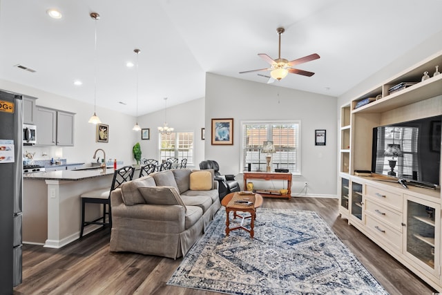 361 Rycola Cir, Myrtle Beach, SC 29575 - living room featuring a ceiling fan, dark wood-style flooring, baseboards, high vaulted ceiling, and a chandelier