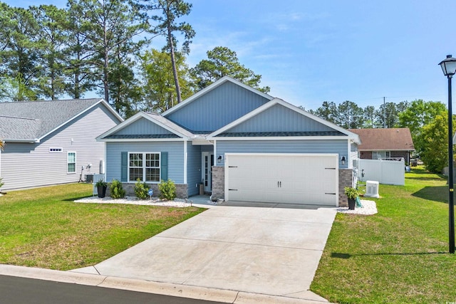 361 Rycola Cir, Myrtle Beach, SC 29575 - craftsman house featuring a garage, stone siding, concrete driveway, a front lawn, and board and batten siding