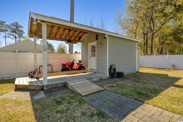 view of outbuilding featuring a fenced backyard