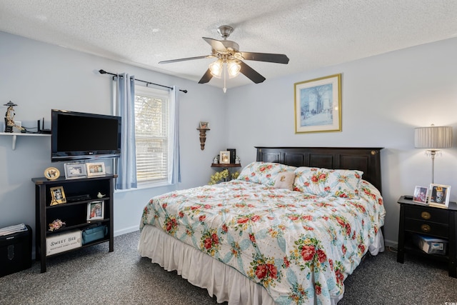 bedroom with a textured ceiling, ceiling fan, baseboards, and carpet floors