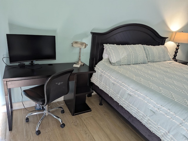 bedroom featuring wood finished floors