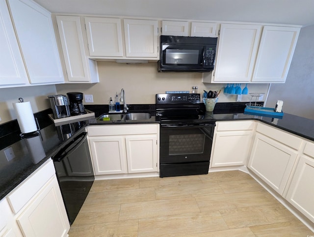 kitchen featuring a sink, white cabinets, black appliances, and dark countertops