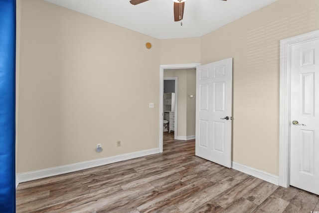 5022 Belleglen Ct Unit 202, Myrtle Beach, SC 29579 - unfurnished bedroom featuring wood finished floors, baseboards, and a ceiling fan