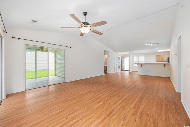 363 Junco Cir, Longs, SC 29568 - unfurnished living room with vaulted ceiling, ceiling fan, light wood-type flooring, and visible vents