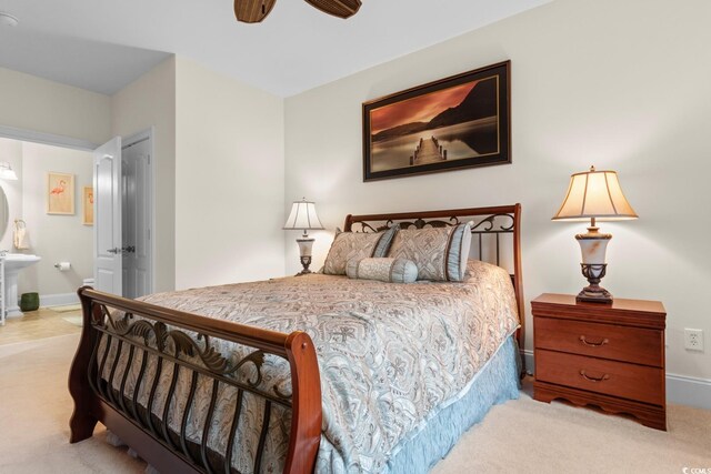 2180 Waterview Dr Unit 1024, North Myrtle Beach, SC 29582 - carpeted bedroom featuring baseboards, ensuite bath, and ceiling fan