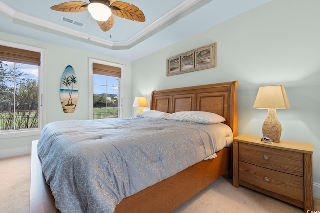 2180 Waterview Dr Unit 1024, North Myrtle Beach, SC 29582 - bedroom featuring a tray ceiling, ornamental molding, access to outside, visible vents, and light carpet