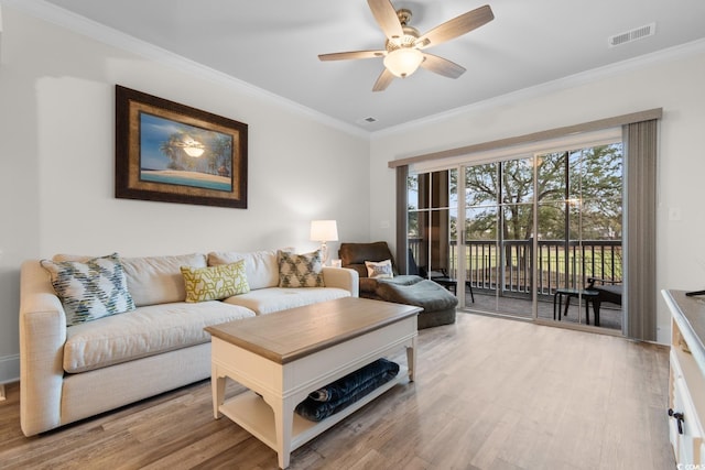 2180 Waterview Dr Unit 1024, North Myrtle Beach, SC 29582 - living room with wood finished floors, visible vents, ornamental molding, and ceiling fan