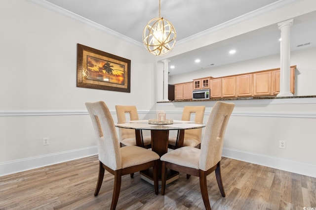 2180 Waterview Dr Unit 1024, North Myrtle Beach, SC 29582 - dining area featuring ornate columns, baseboards, light wood-style flooring, and crown molding