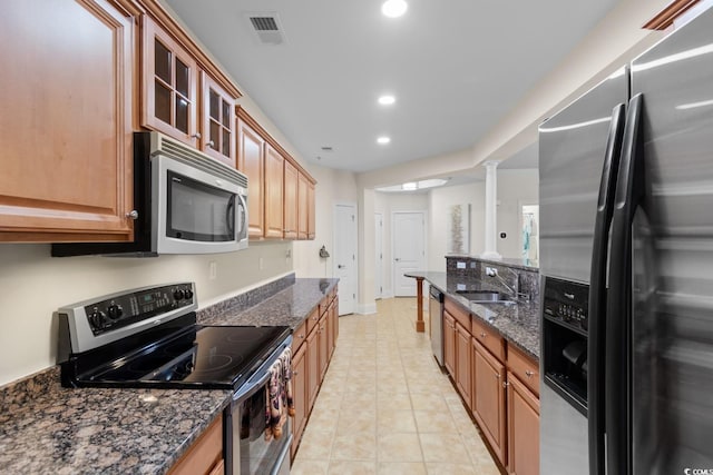 2180 Waterview Dr Unit 1024, North Myrtle Beach, SC 29582 - kitchen featuring a sink, dark stone countertops, visible vents, and stainless steel appliances