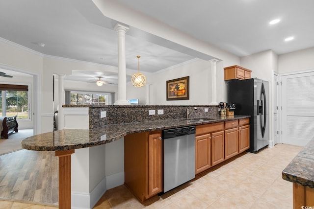 2180 Waterview Dr Unit 1024, North Myrtle Beach, SC 29582 - kitchen with a peninsula, ornate columns, ceiling fan, appliances with stainless steel finishes, and backsplash