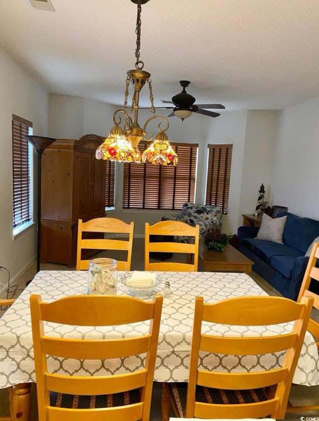 dining space featuring ceiling fan
