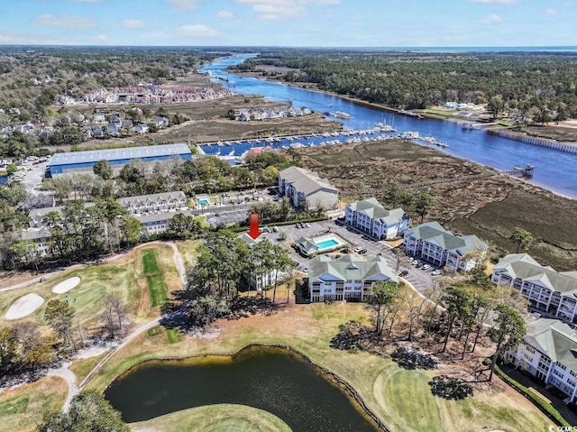 birds eye view of property with a water view and view of golf course