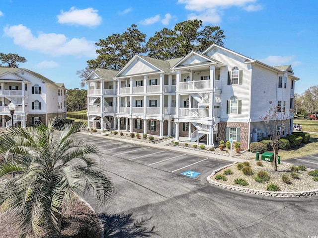 view of property with uncovered parking