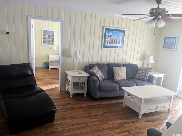 living room featuring a ceiling fan and wood finished floors