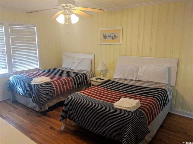 bedroom with a ceiling fan and wood finished floors