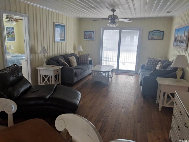 living area featuring dark wood finished floors and ceiling fan