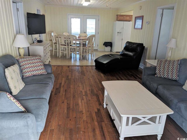 living area with dark wood finished floors and french doors