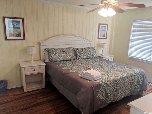 bedroom with baseboards, ornamental molding, a ceiling fan, and dark wood-style flooring