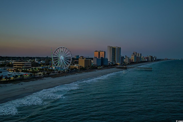 view of water feature with a city view and a beach view