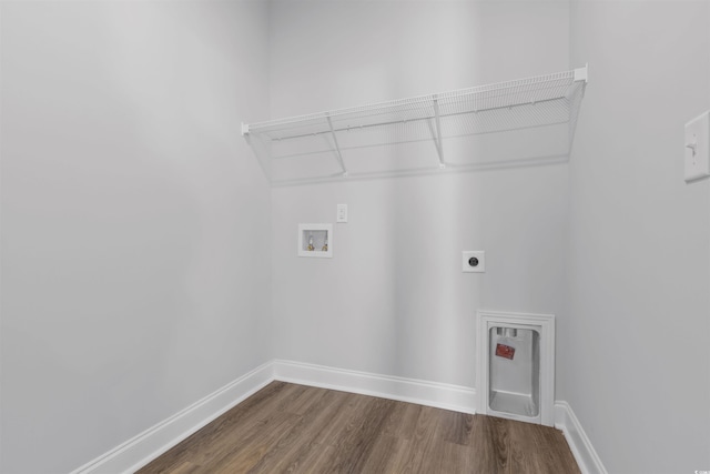 laundry room featuring electric dryer hookup, baseboards, washer hookup, laundry area, and wood finished floors