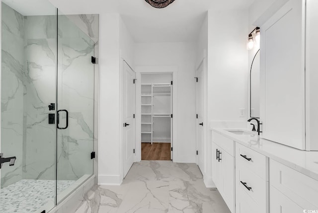 318 Vista Dr, Murrells Inlet, SC 29576 - bathroom with marble finish floors, a marble finish shower, vanity, and a spacious closet