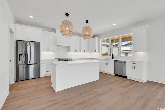 318 Vista Dr, Murrells Inlet, SC 29576 - kitchen with stainless steel appliances, light countertops, white cabinets, tasteful backsplash, and recessed lighting