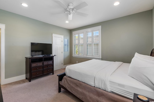 carpeted bedroom featuring recessed lighting, baseboards, and a ceiling fan