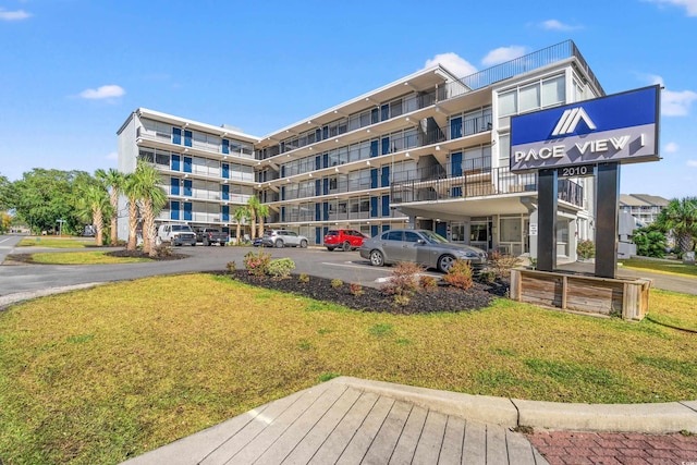 2010 S Ocean Blvd, Myrtle Beach, SC 29577 - view of apartment building / complex featuring uncovered parking